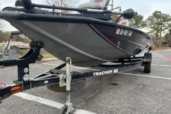 Slide: The Image of 2015 Tracker Pro Team 175 TXW boat on trailer in parking lot. - 6