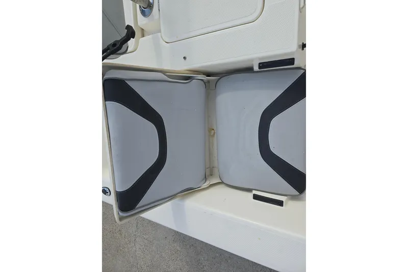Slide: The Image of 2021 Skeeter SX240 boat seating with gray and black cushions. - 13