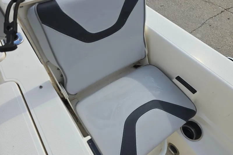 Slide: The Image of 2021 Skeeter SX240 boat seat with black and gray upholstery design. - 14