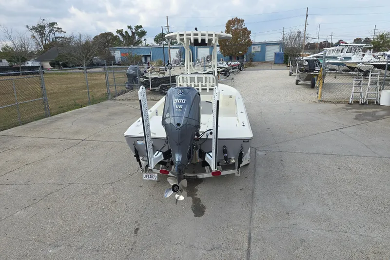 Slide: The Image of 2021 Skeeter SX240 boat with Yamaha 300 V6 engine in a boatyard. - 3