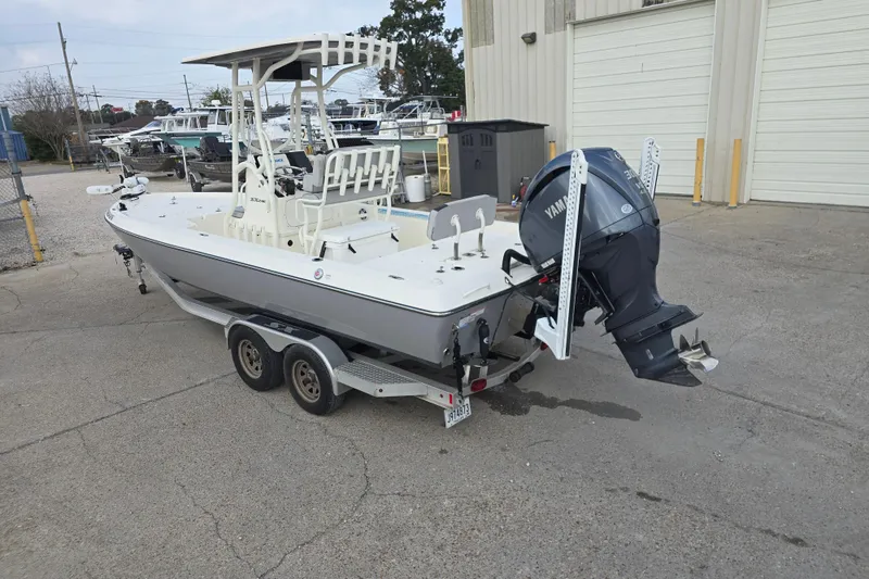 Slide: The Image of 2021 Skeeter SX240 boat with Yamaha outboard motor on a trailer. - 4