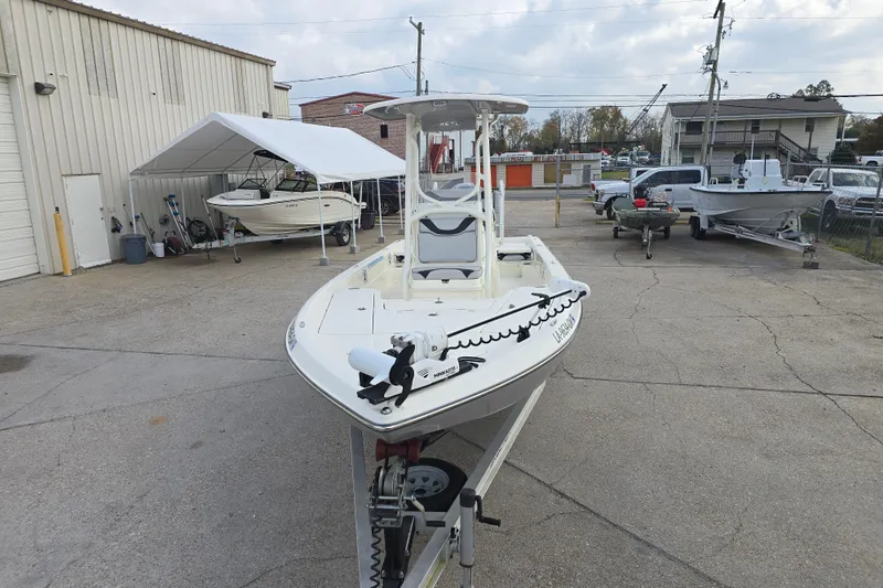 Slide: The Image of 2021 Skeeter SX240 boat on trailer in outdoor storage area. - 7