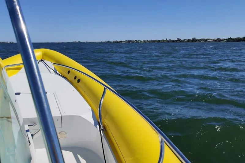 Slide: The Image of Yellow Arctic Blue 29 boat cruising on a sunny day, 2019 model. - 11