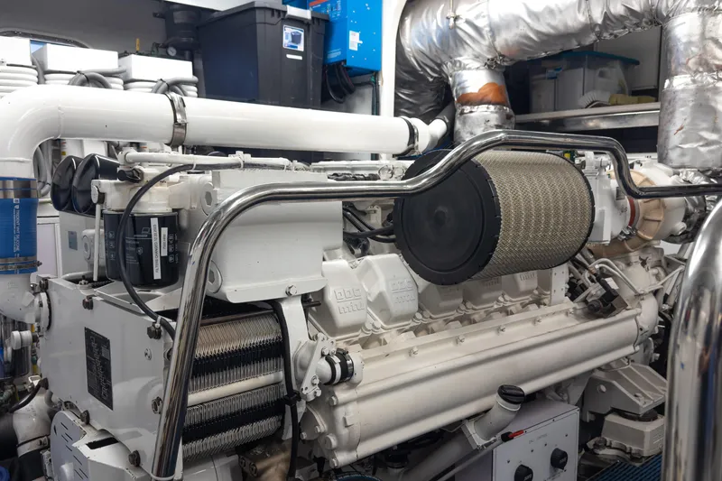Slide: The Image of Engine room of 2005 Ocean Alexander 80 Motoryacht, featuring a powerful marine engine. - 118