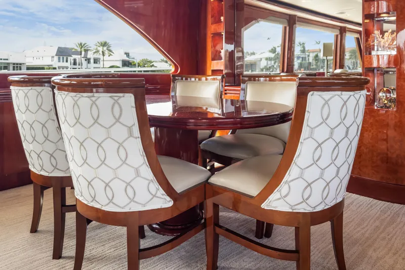 Slide: The Image of Luxurious dining area on 2005 Ocean Alexander 80 Motoryacht with elegant wood and upholstered chairs. - 22