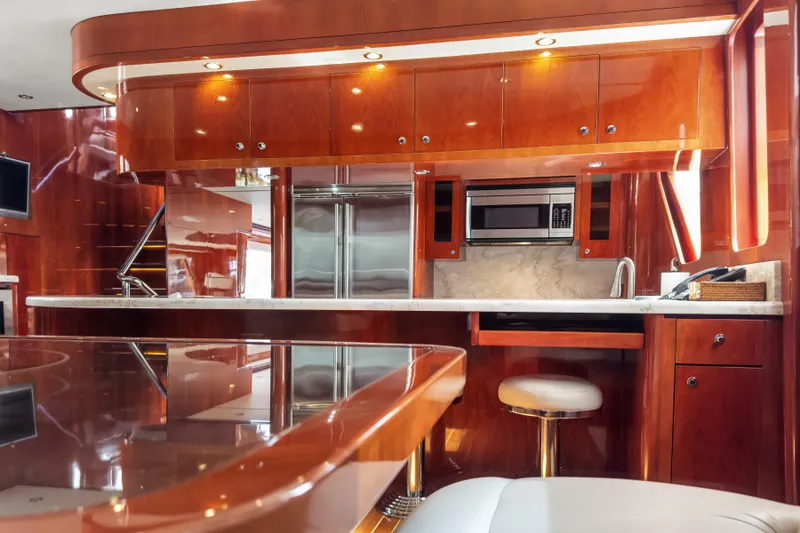 Slide: The Image of Luxurious kitchen interior of 2005 Ocean Alexander 80 Motoryacht with wood cabinetry and modern appliances. - 25