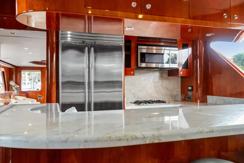 Slide: The Image of Luxurious kitchen interior of 2005 Ocean Alexander 80 Motoryacht with marble countertops. - 26