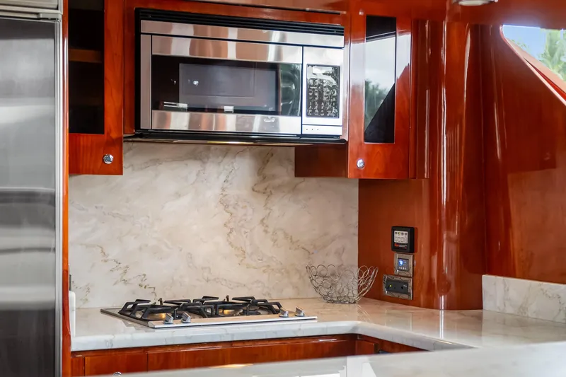 Slide: The Image of Luxurious kitchen interior of 2005 Ocean Alexander 80 Motoryacht with marble backsplash and modern appliances. - 27