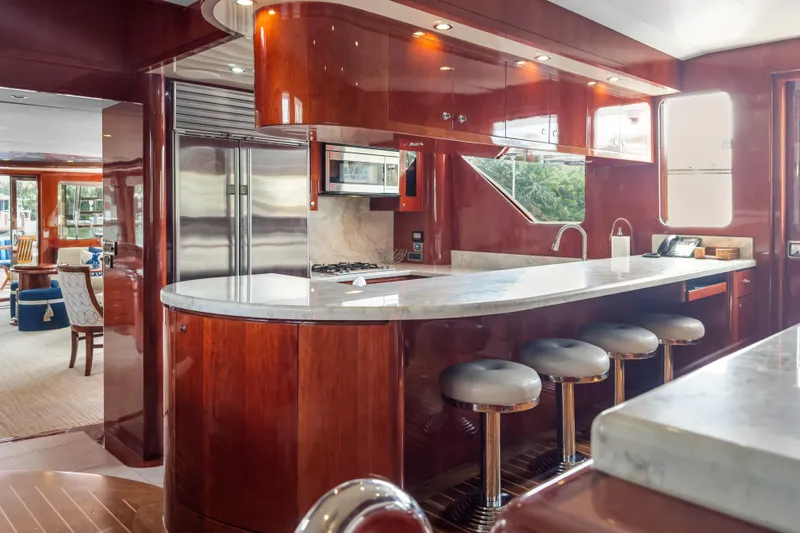 Slide: The Image of Luxurious kitchen interior of 2005 Ocean Alexander 80 Motoryacht with sleek countertops and bar stools. - 31