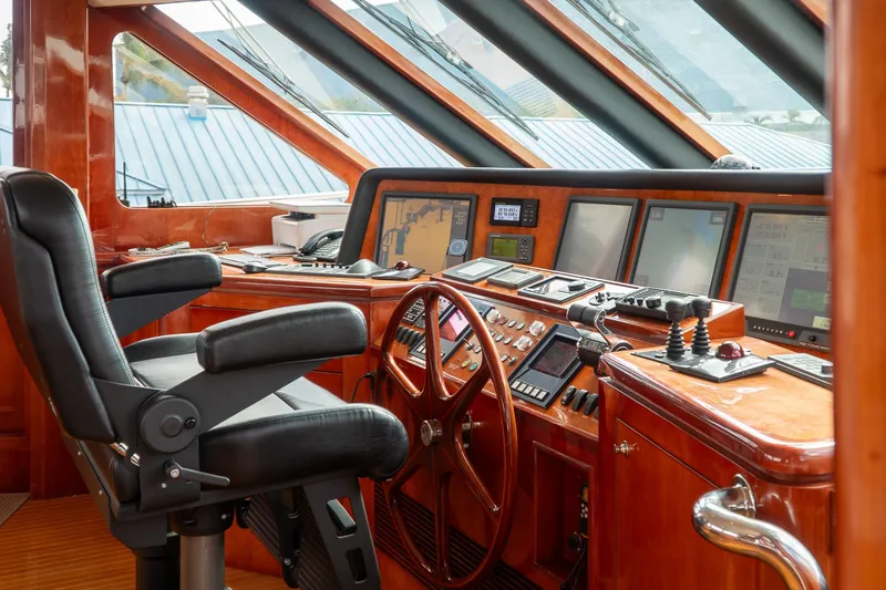 Slide: The Image of Luxurious helm of 2005 Ocean Alexander 80 Motoryacht with advanced navigation controls. - 46