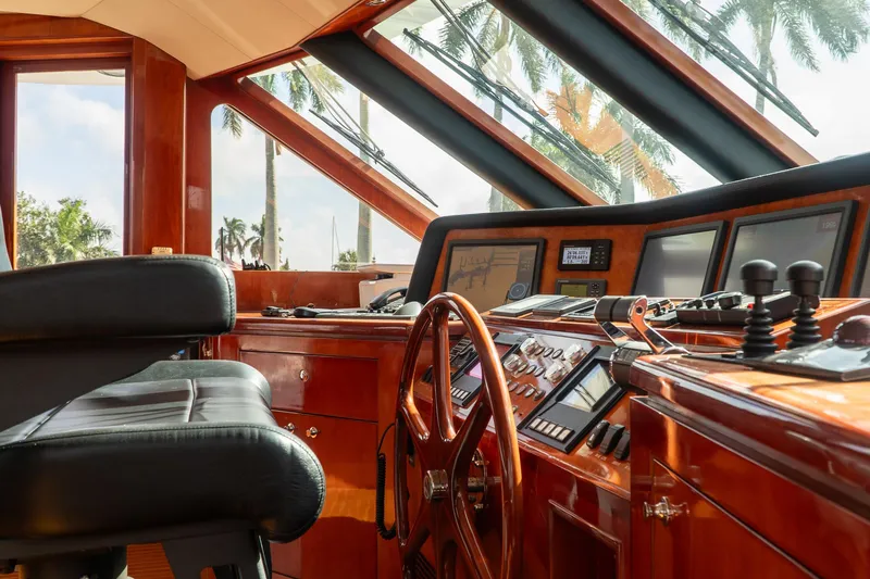 Slide: The Image of Pilothouse of 2005 Ocean Alexander 80 Motoryacht with luxurious wood finish and modern controls. - 47