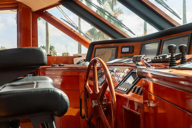 Slide: The Image of Luxurious helm of 2005 Ocean Alexander 80 Motoryacht with polished wood and advanced controls. - 49