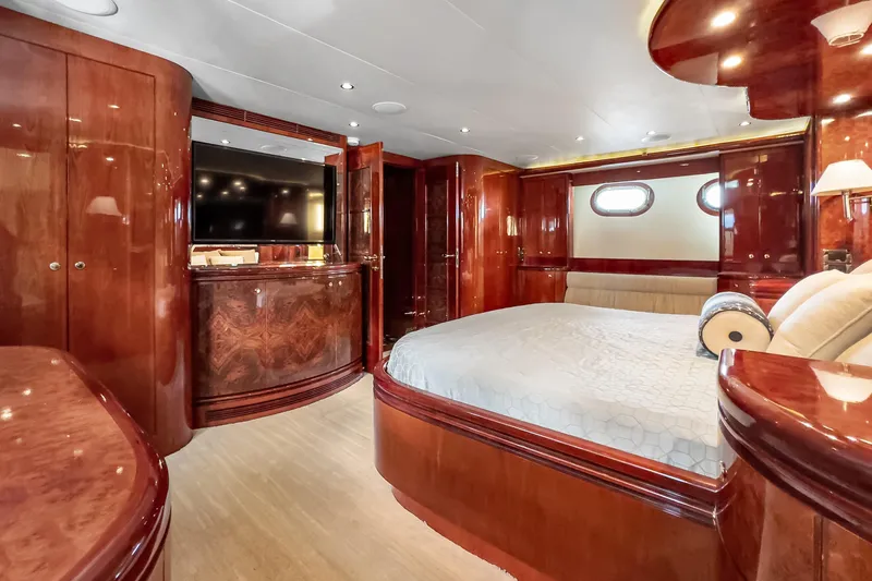 Slide: The Image of Luxurious 2005 Ocean Alexander 80 Motoryacht bedroom with elegant wood finishes and modern amenities. - 55