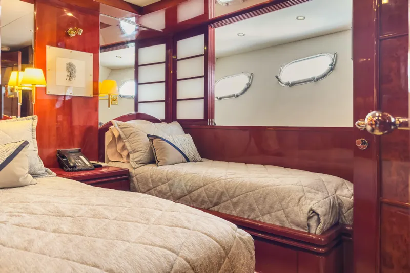 Slide: The Image of Luxurious 2005 Ocean Alexander 80 Motoryacht bedroom with elegant wood finishes and cozy bedding. - 71