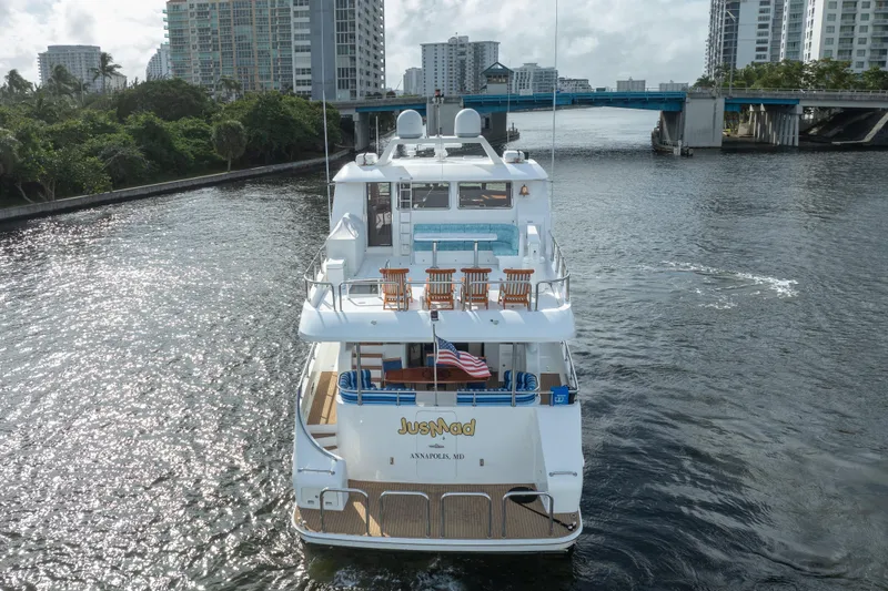 Slide: The Image of Ocean Alexander 80 Motoryacht 2005 cruising near urban waterfront with bridge and buildings. - 84