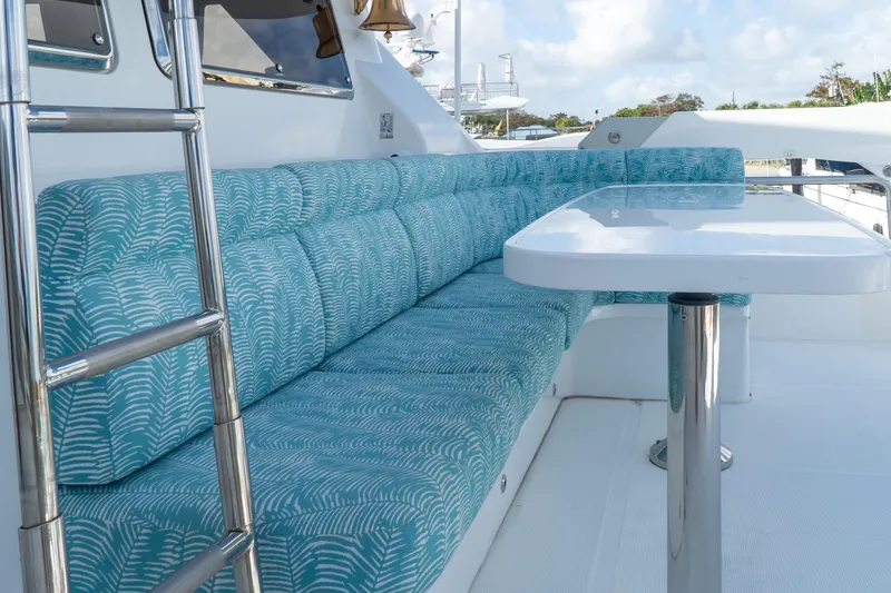 Slide: The Image of Ocean Alexander 80 Motoryacht 2005, outdoor seating with patterned cushions and table. - 9