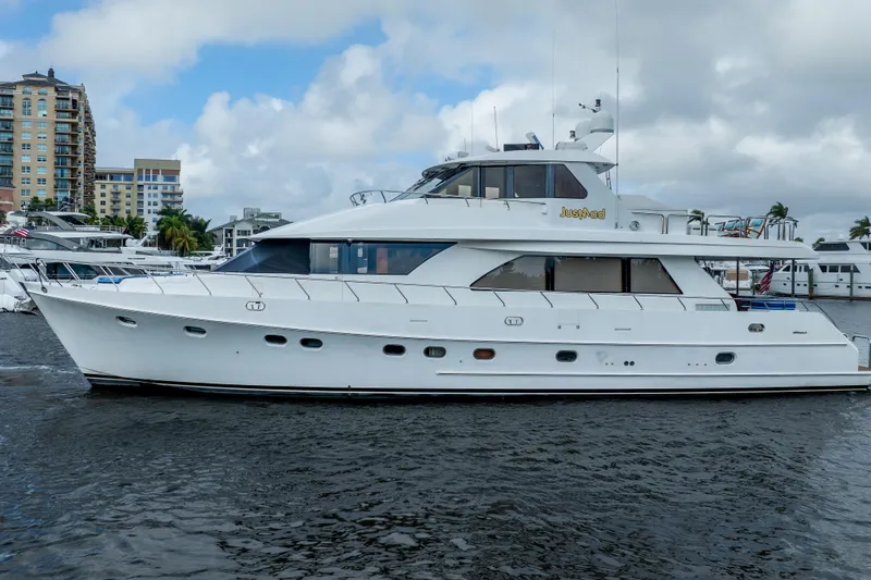 Slide: The Image of 2005 Ocean Alexander 80 Motoryacht on water, with cityscape background. - 97