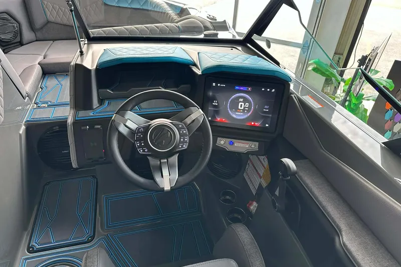 Slide: The Image of 2026 Tigé Z3 boat interior with modern steering and digital dashboard display. - 14