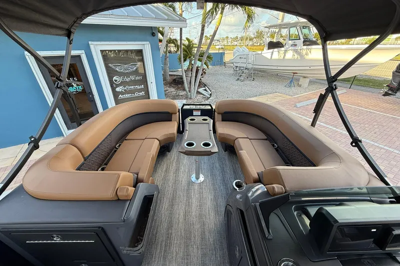 Slide: The Image of 2026 Bennington 22 M Swingback boat interior with luxurious seating and table setup. - 21