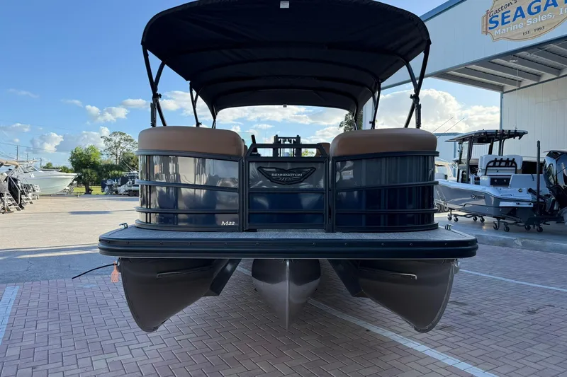 Slide: The Image of 2026 Bennington 22 M Swingback pontoon boat at a marina under a clear sky. - 3