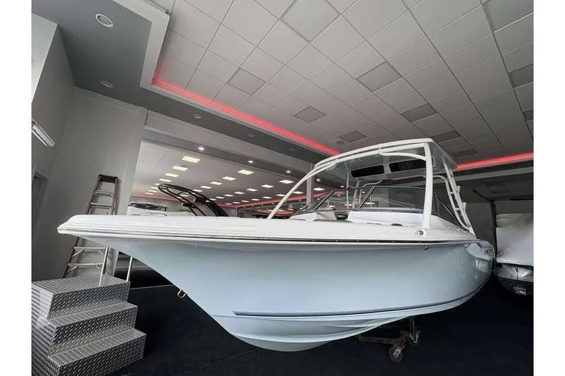 The Image of 2026 Key West 239 DFS boat displayed in a showroom with modern lighting. - 1
