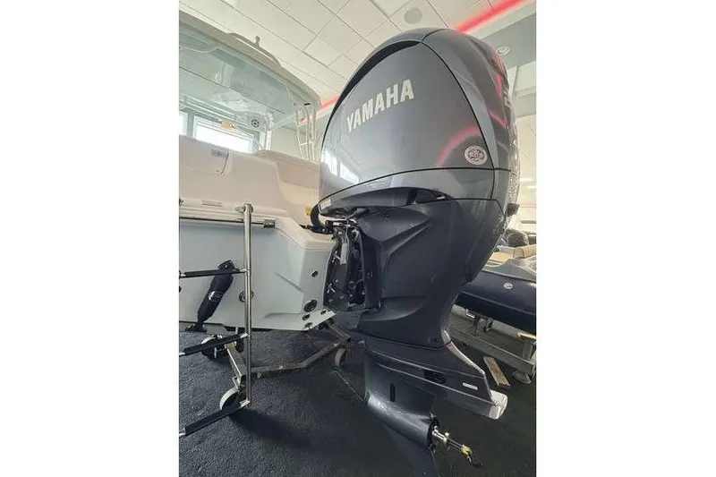 Slide: The Image of 2026 Key West 239 DFS boat with Yamaha outboard motor in showroom. - 13
