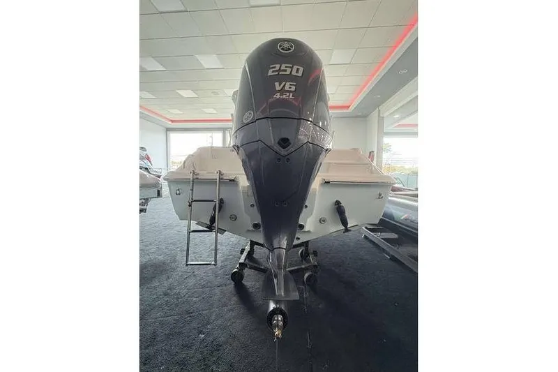 Slide: The Image of 2026 Key West 239 DFS boat with 250 V6 4.2L engine in showroom. - 14