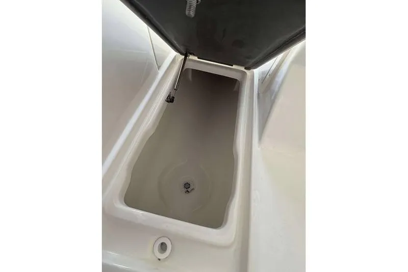 Slide: The Image of Open storage compartment in 2026 Key West 239 DFS boat. - 20