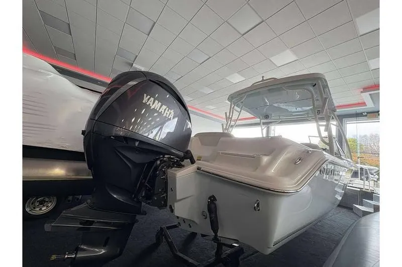 Slide: The Image of 2026 Key West 239 DFS boat with Yamaha outboard motor in showroom. - 7
