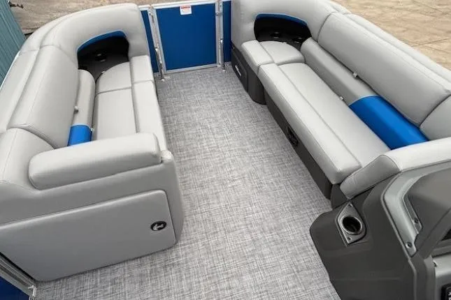 Slide: The Image of 2026 Sun Tracker Party Barge 20 DLX interior with gray and blue seating. - 6