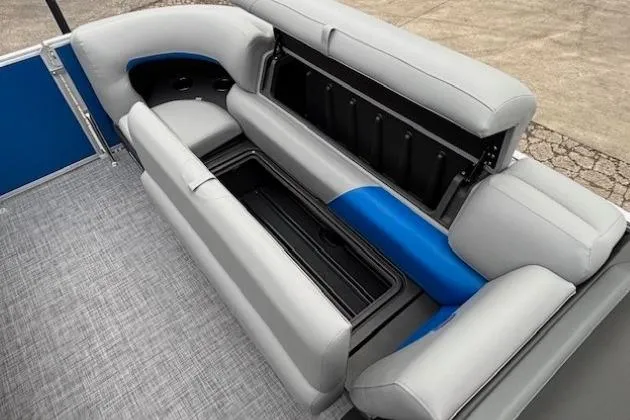 Slide: The Image of 2026 Sun Tracker Party Barge 20 DLX interior seating with storage compartment. - 7