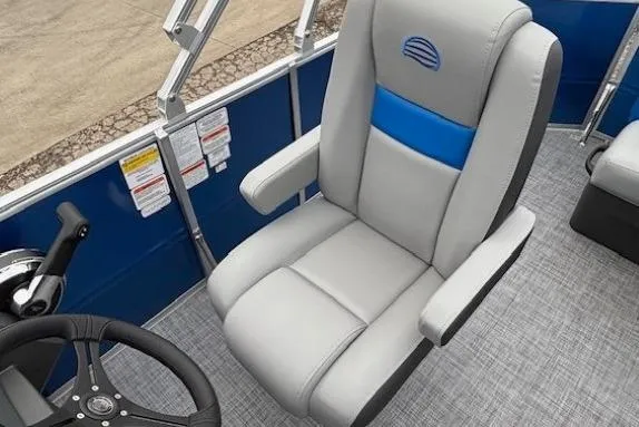 Slide: The Image of 2026 Sun Tracker Party Barge 20 DLX captain's chair and steering wheel, featuring sleek design. - 9