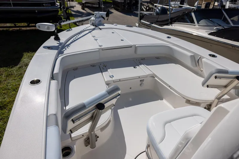 Slide: The Image of 2024 Robalo 246 Cayman boat interior with seating and storage compartments. - 14