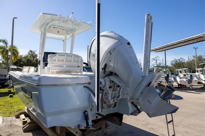 Slide: The Image of 2024 Robalo 246 Cayman boat with powerful outboard motor, displayed outdoors. - 4