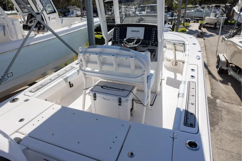 Slide: The Image of 2024 Robalo 246 Cayman boat interior with helm and seating area. - 5