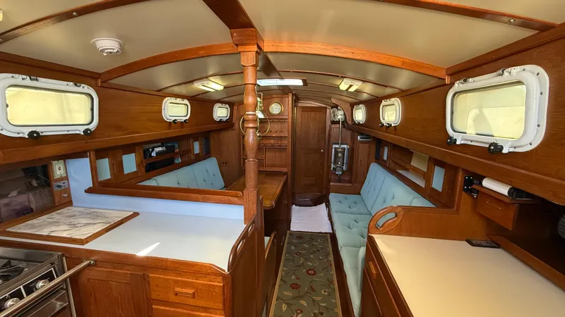 Slide: The Image of Interior of 1984 Cascade 36 sailboat with wooden finish and cozy seating. - 2