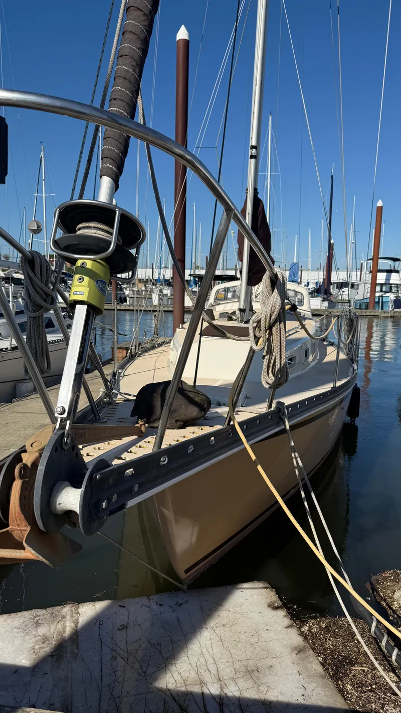 Slide: The Image of 1984 Cascade 36 sailboat docked in marina, clear blue sky, surrounded by other boats. - 20
