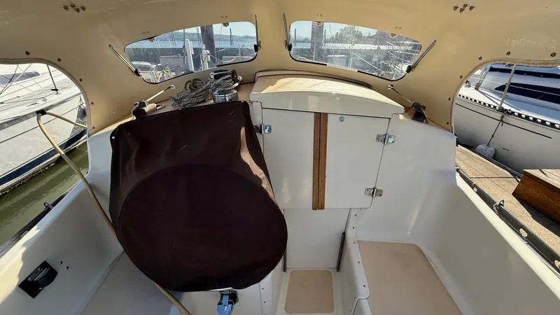 Slide: The Image of 1984 Cascade 36 sailboat cockpit with covered wheel and cabin entrance. - 22