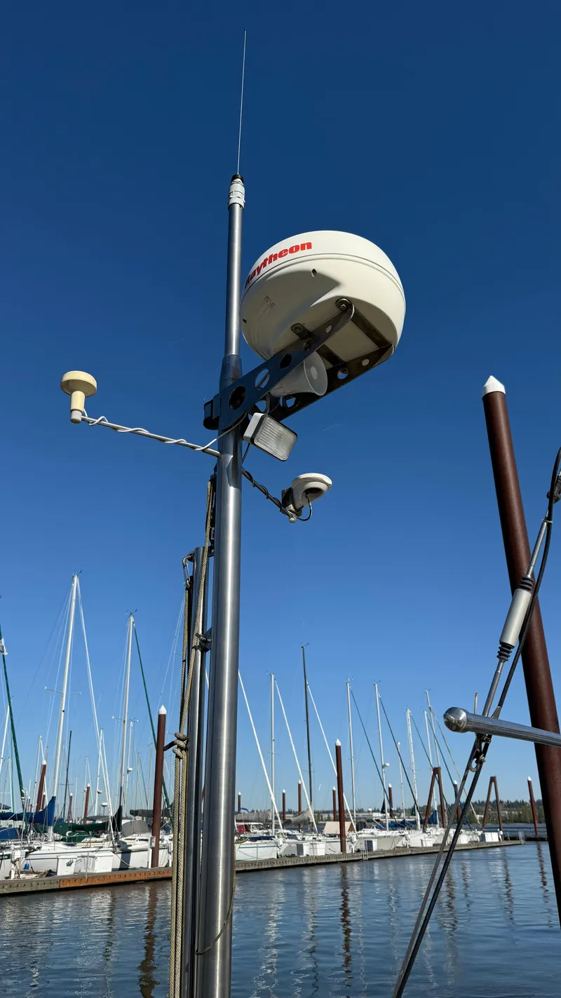 Slide: The Image of Sailboat mast with radar and antennas, Cascade 36, 1984, docked at marina under clear blue sky. - 23