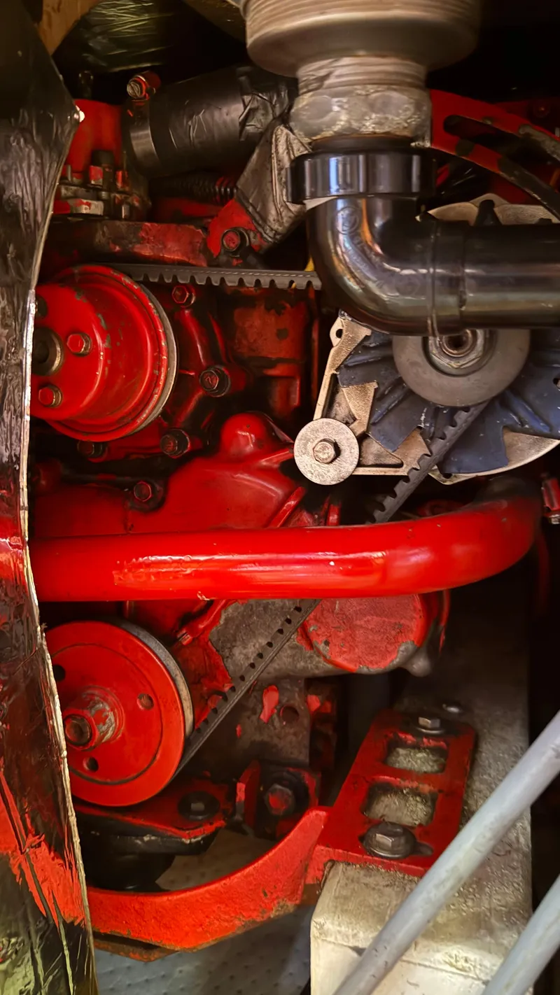 Slide: The Image of 1984 Cascade 36 engine with red components and visible fan belt. - 25