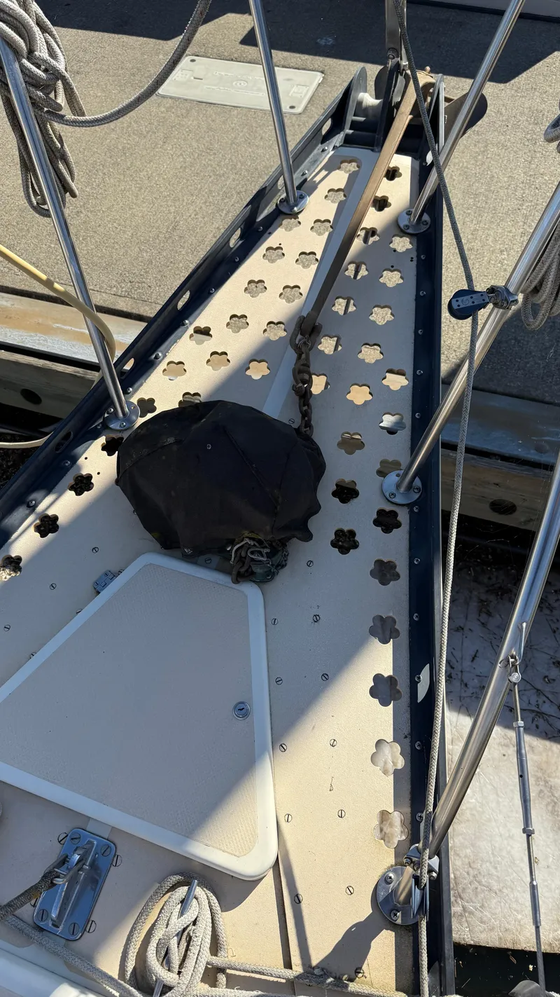 Slide: The Image of 1984 Cascade 36 sailboat deck with ropes and fittings, featuring a perforated design. - 27