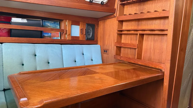 Slide: The Image of Wooden interior of 1984 Cascade 36 sailboat with table and shelves. - 8