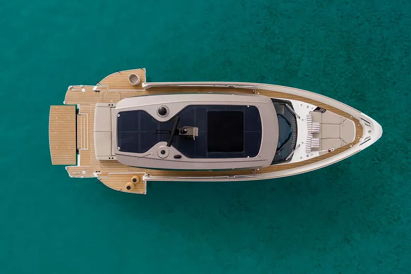 Slide: The Image of Manufacturer Provided Image: Aerial view of 2025 Azimut Seadeck 6 yacht on turquoise water. - 2