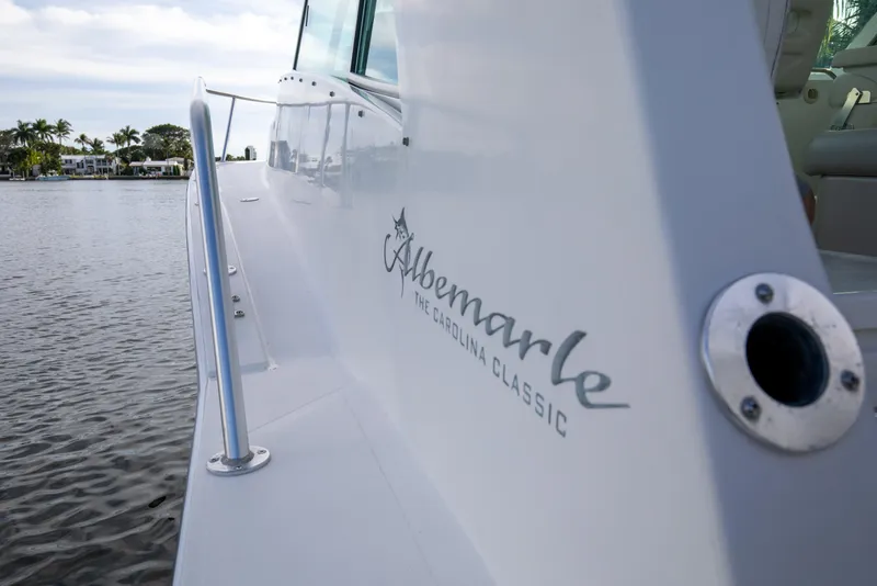 Slide: The Image of 2015 Albemarle 360 Express Fisherman boat on calm water, showcasing sleek design. - 11