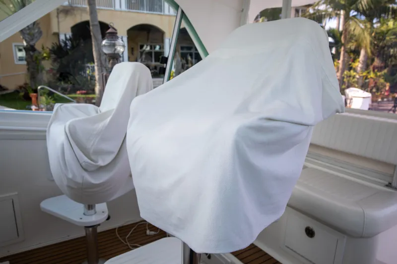 Slide: The Image of Covered seats on a 2015 Albemarle 360 Express Fisherman boat interior. - 15