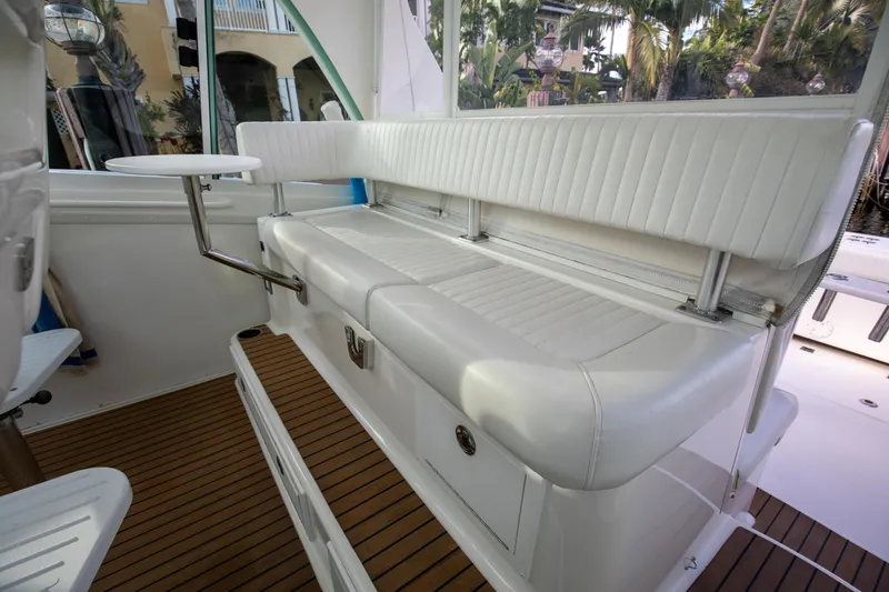 Slide: The Image of 2015 Albemarle 360 Express Fisherman interior seating with white upholstery and wooden flooring. - 26