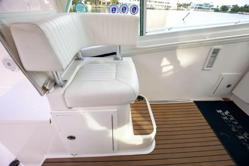 Slide: The Image of 2015 Albemarle 360 Express Fisherman interior with white seating and wooden flooring. - 27