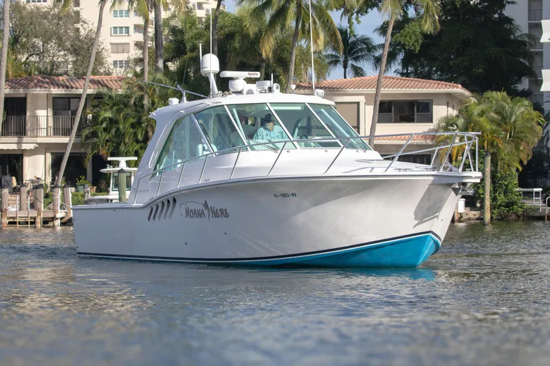 Slide: The Image of 2015 Albemarle 360 Express Fisherman boat on water, surrounded by tropical scenery. - 3