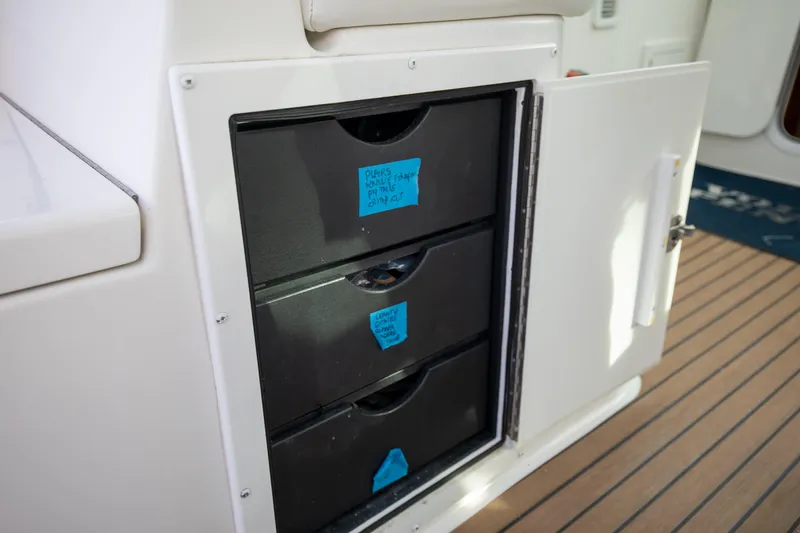 Slide: The Image of Storage drawers on a 2015 Albemarle 360 Express Fisherman boat, labeled for organization. - 30