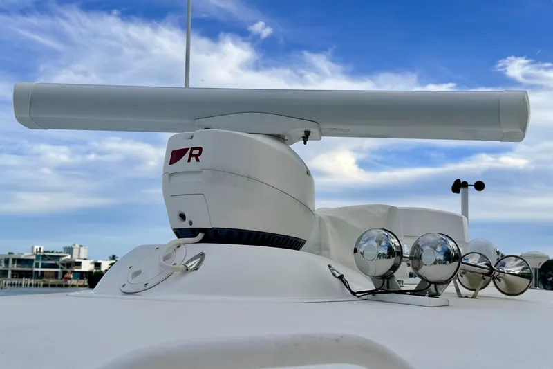 Slide: The Image of Radar and lights on 2015 Albemarle 360 Express Fisherman boat under blue sky. - 35